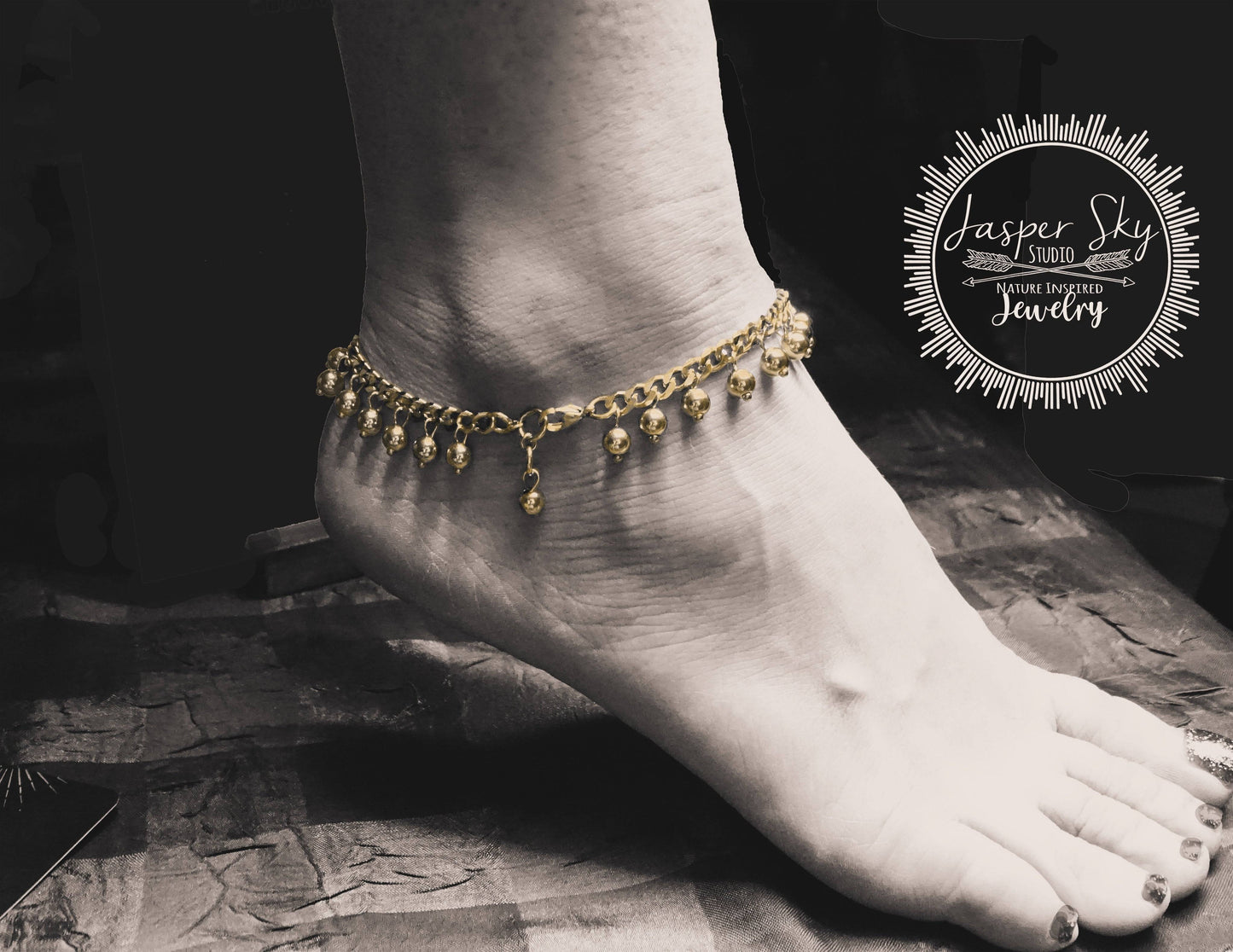Dangle Gold Anklet with 18K plating and adjustable fit, featuring boho chic dangling charms. Perfect fashion anklet for women.
