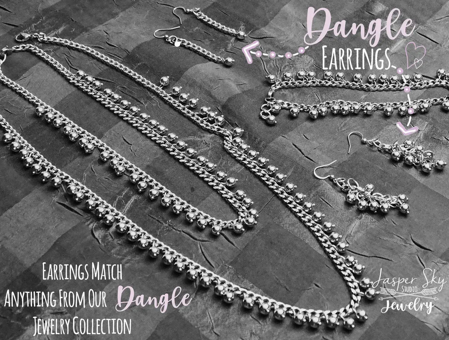 Matching handcrafted silver dangle earrings and necklace set. Perfect for completing a chic and elegant jewelry look.