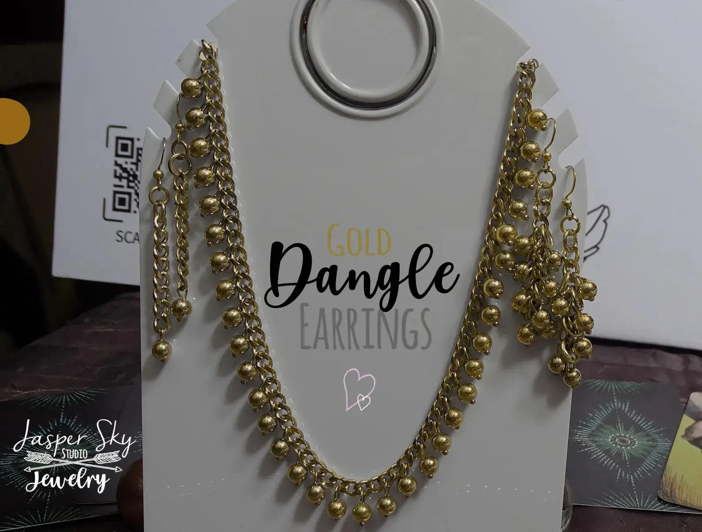 Complete jewelry set with Handcrafted Gold Long Dangle Earrings and matching necklace on display card, perfect for elegant gifting.
