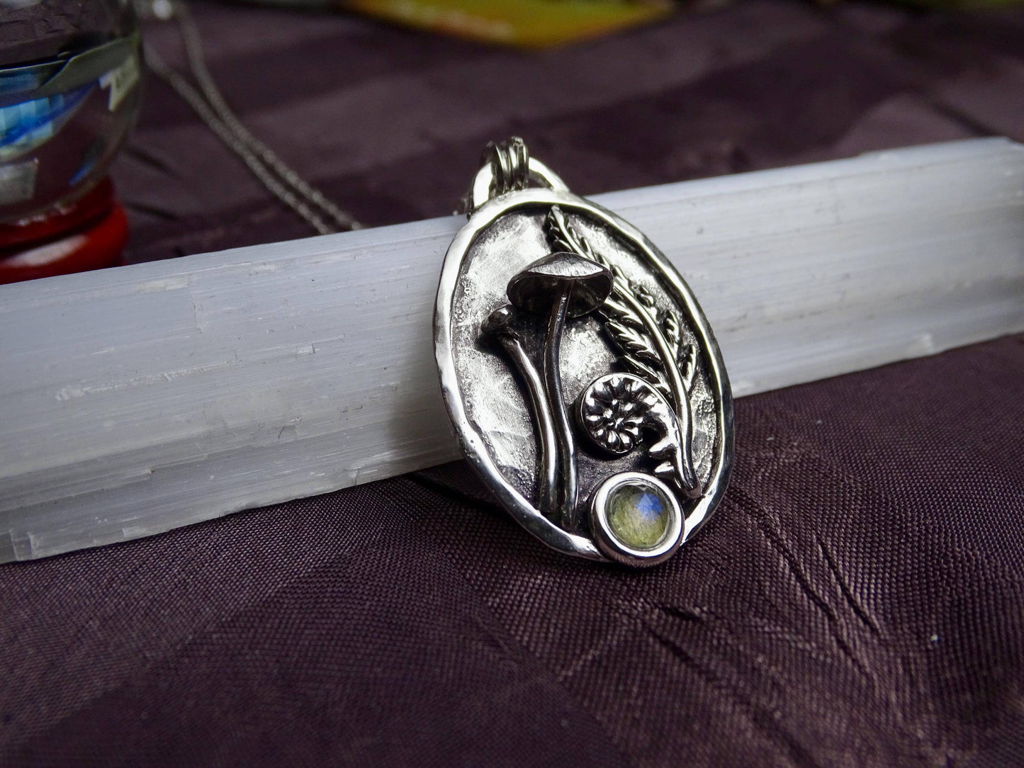 Detailed view of handmade sterling silver mushroom pendant with fern texture and labradorite, perfect as a unique Christmas or holiday gift.