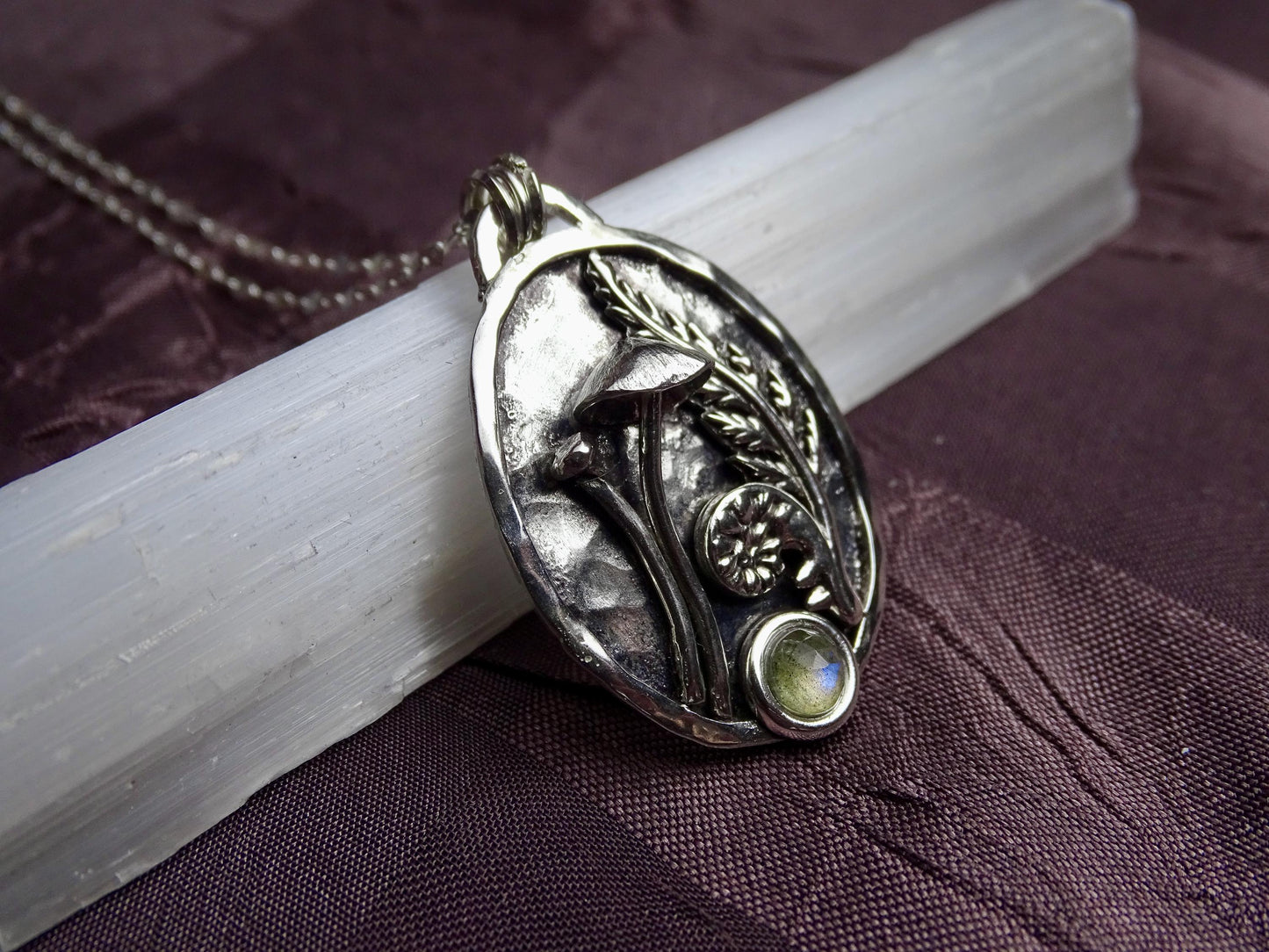 Elegant sterling silver pendant with raised mushroom and fern design, accented by a labradorite stone, ideal for nature lovers and gift-giving.