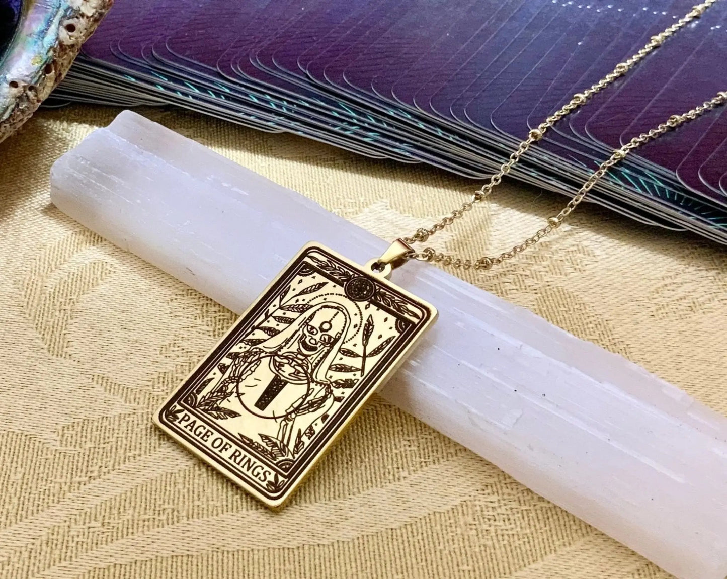 gold page of rings tarot card necklace