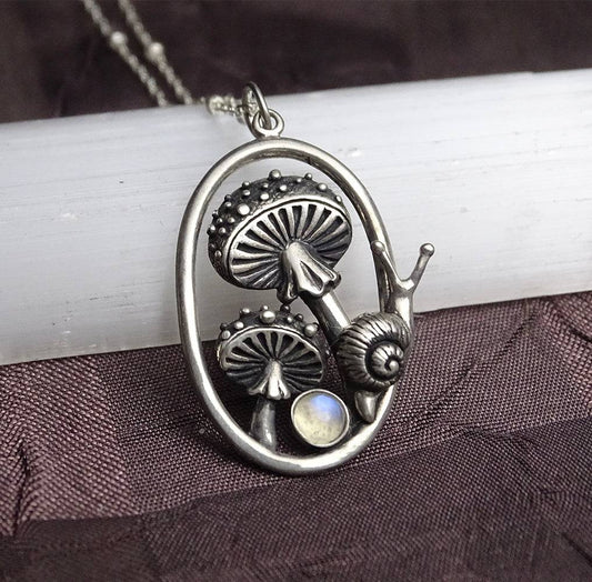 Sterling silver mushroom and snail pendant with moonstone accent