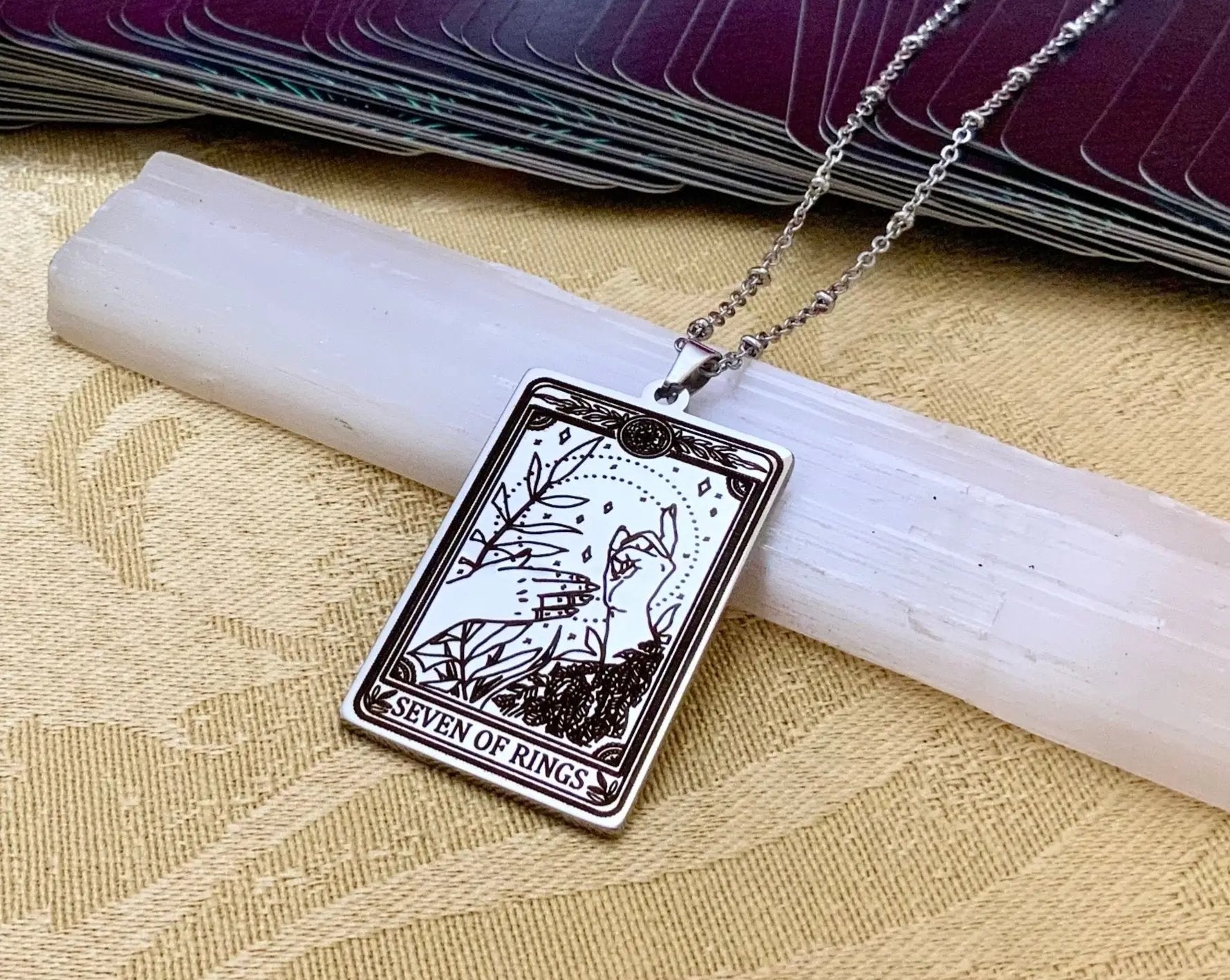 seven of rings tarot card necklace